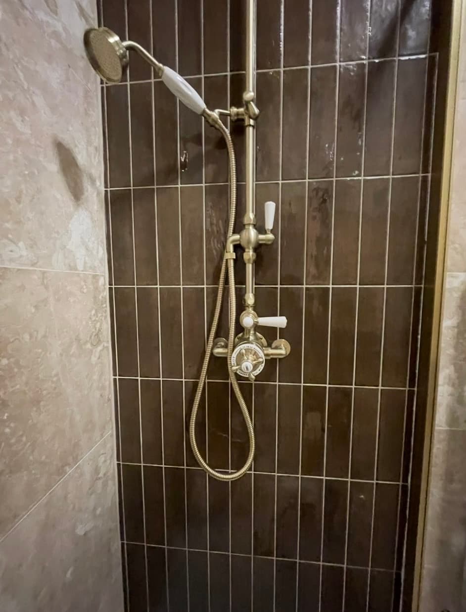 Heritage brass shower set with feature tile detail